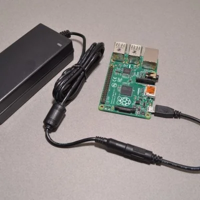 5V 5A power supply with 2.1mm DC Barrel Jack and adapter cable connected to Raspberry Pi