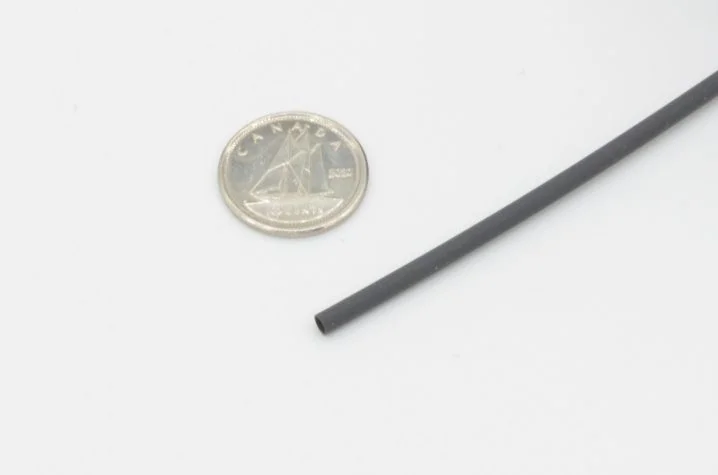 1/16" Heat Shrink Tubing compared to the size of a canadian dime
